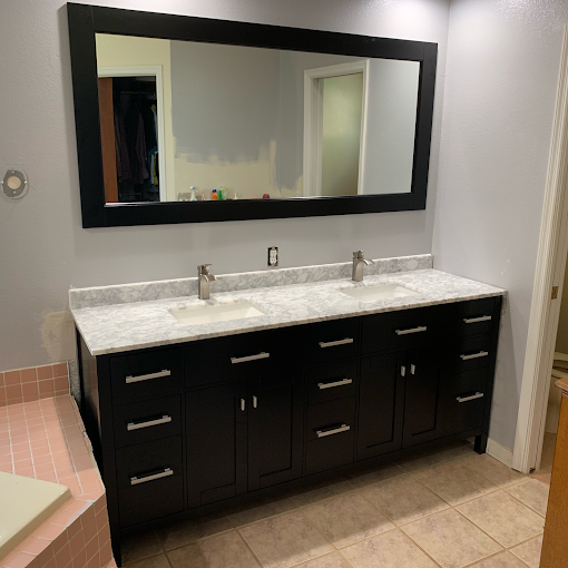 Bathroom vanity installation with modern sink and fixtures