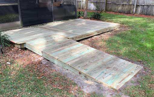Custom-built wooden wheelchair ramp for improved accessibility